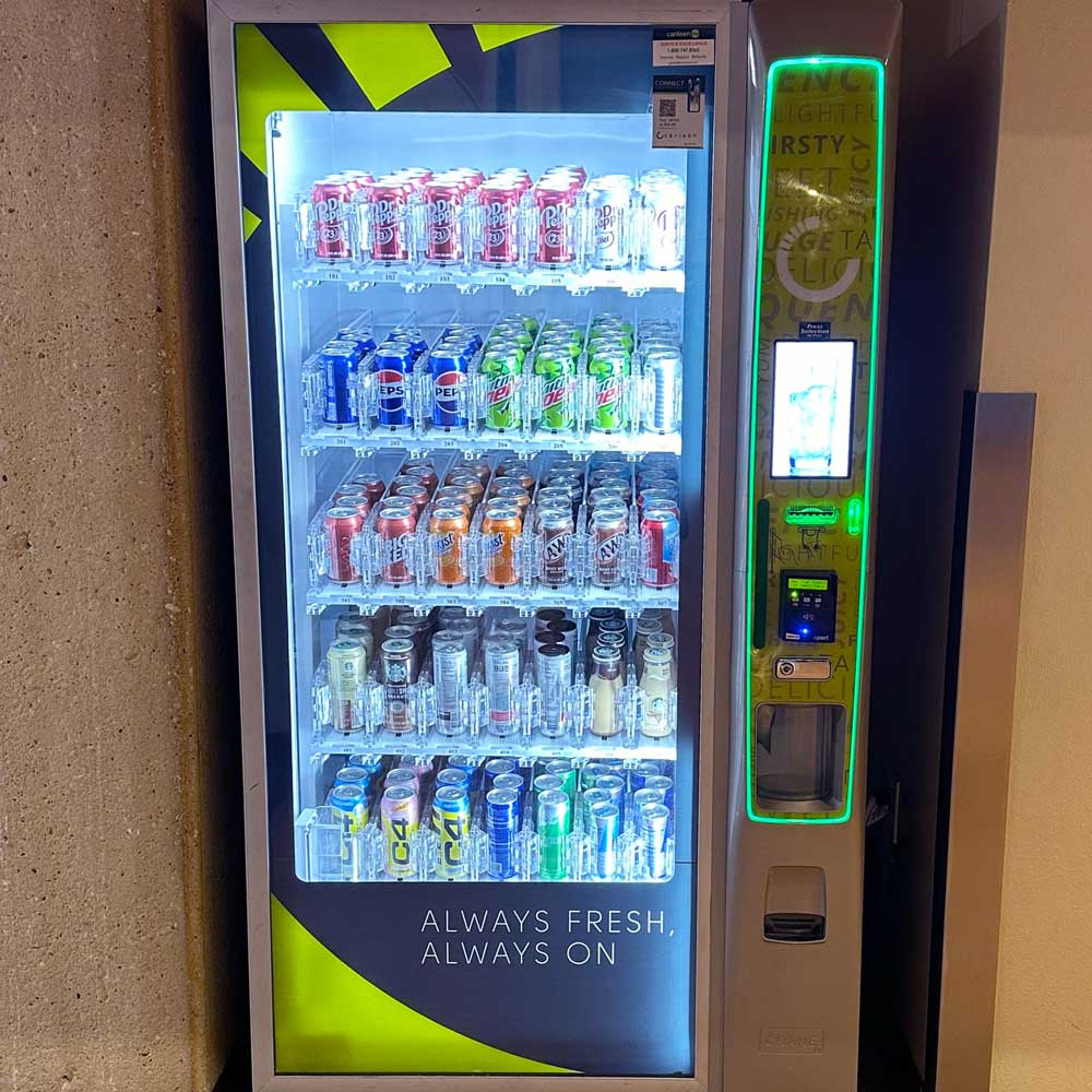 A vending machine offering drinks packaged in aluminum containers.