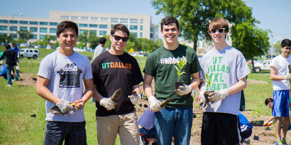 Changes to Sustainability Service Honors Requirements. Students planting trees.
