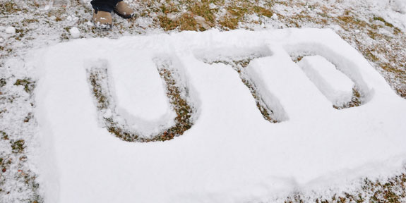 Sustainability Tips for the Holiday Season. The letters U-T-D written in the snow.