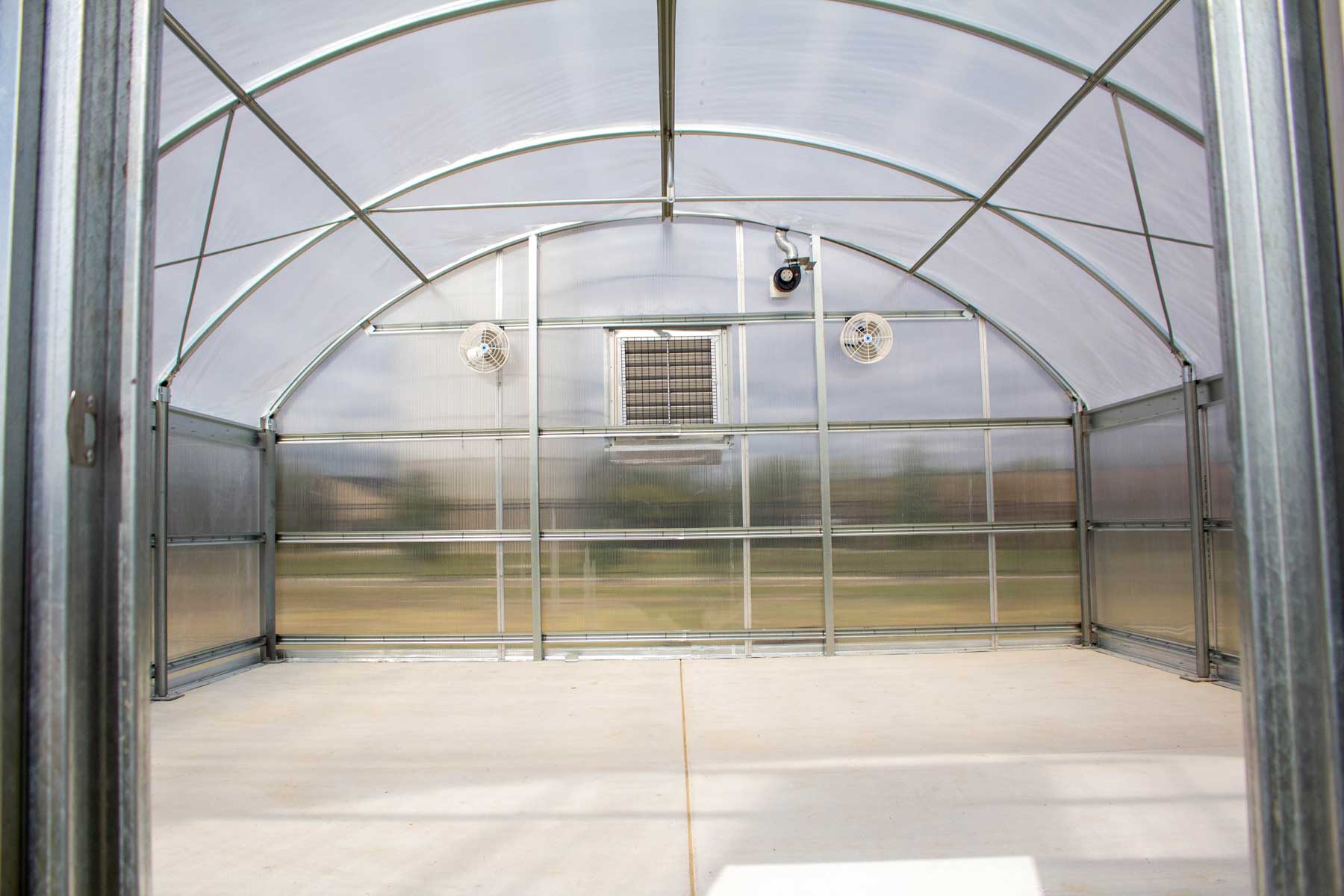 A view of the interior of the new greenhouse showing its ventilation system.