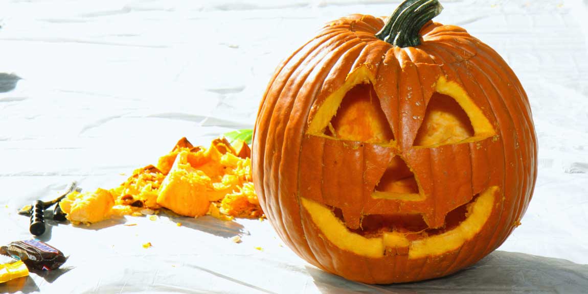 A pumpkin carved into a Jack-O-Lantern.