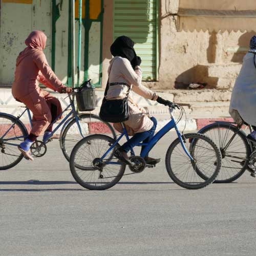 Women riding bicycles.