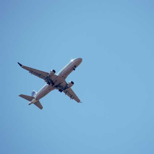 A passenger jet plane in flight.