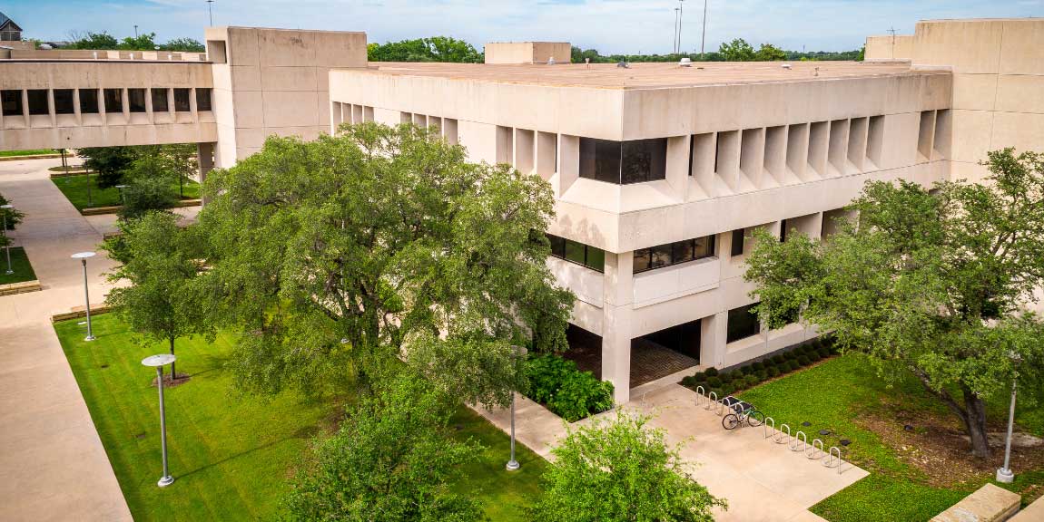 An aerial view of Cecil H. Green Hall and part of Margaret McDermott Mall on the campus of UT Dallas.