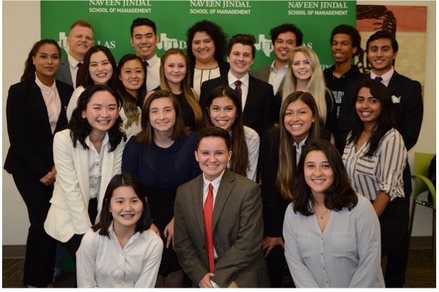 A group of Management students pose together.